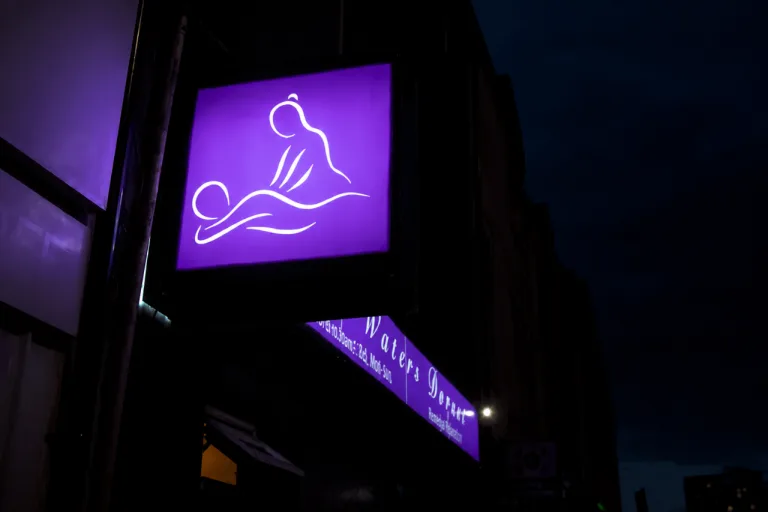 Calm Waters Dorset glowing sign at night